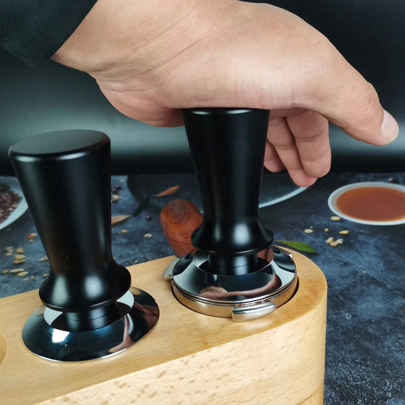 Upgrade your espresso game with the Ledander Premium Espresso Tamper. This spring-loaded tamper features adjustable pressure and an aluminum handle, available in 51mm, 53mm, and 58mm sizes. The stainless steel base makes it compatible with most machines