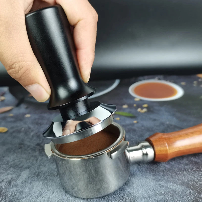 Upgrade your espresso game with the Ledander Premium Espresso Tamper. This spring-loaded tamper features adjustable pressure and an aluminum handle, available in 51mm, 53mm, and 58mm sizes. The stainless steel base makes it compatible with most machines