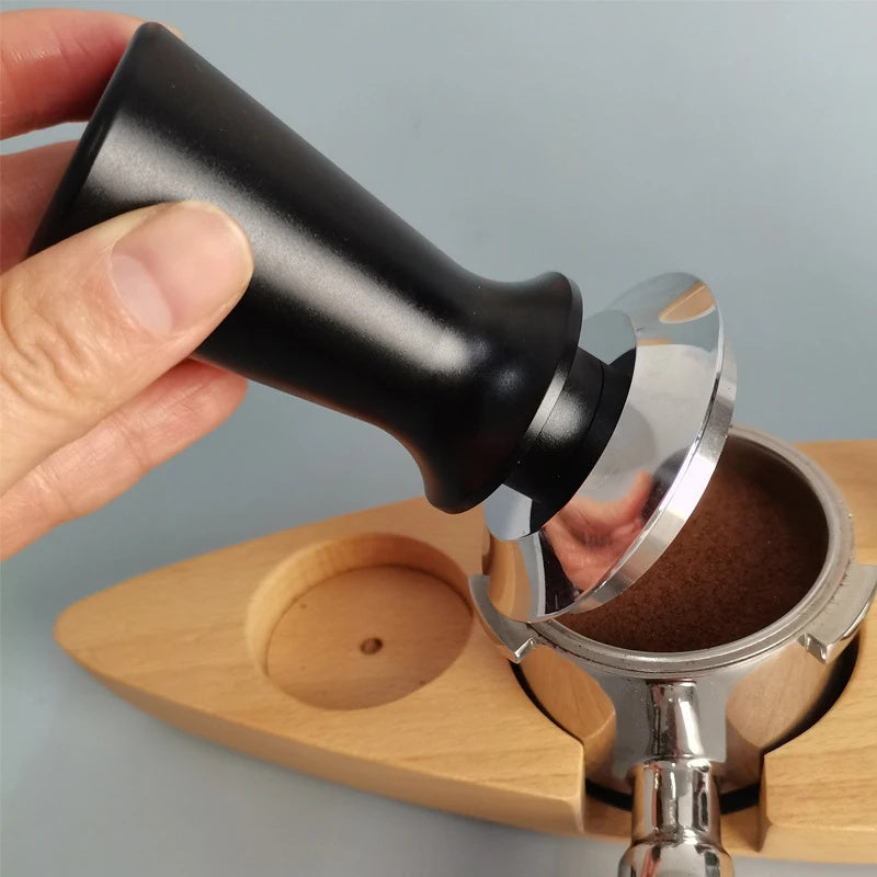 Upgrade your espresso game with the Ledander Premium Espresso Tamper. This spring-loaded tamper features adjustable pressure and an aluminum handle, available in 51mm, 53mm, and 58mm sizes. The stainless steel base makes it compatible with most machines