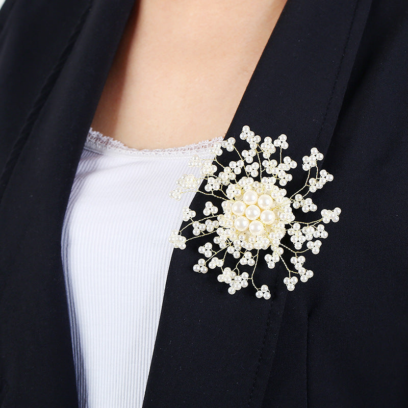 Stylish and luxurious rhinestone and pearl brooch with a unique irregular shape. This upscale fashion statement pin is perfect for coats, weddings, parties, and makes a beautiful gift.