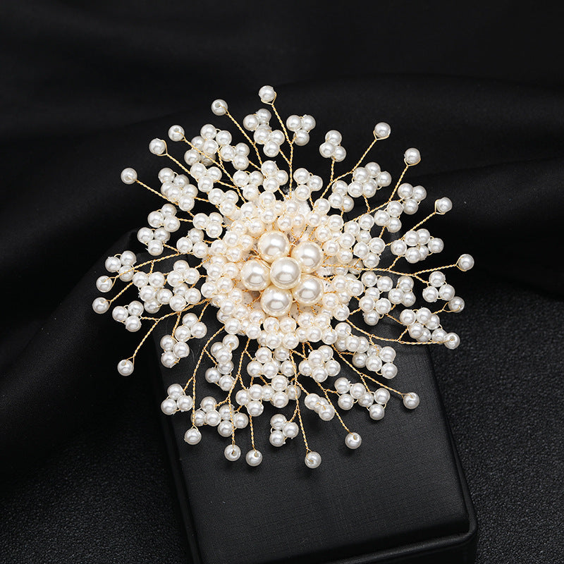 Stylish and luxurious rhinestone and pearl brooch with a unique irregular shape. This upscale fashion statement pin is perfect for coats, weddings, parties, and makes a beautiful gift.