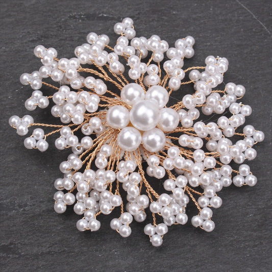 Stylish and luxurious rhinestone and pearl brooch with a unique irregular shape. This upscale fashion statement pin is perfect for coats, weddings, parties, and makes a beautiful gift.