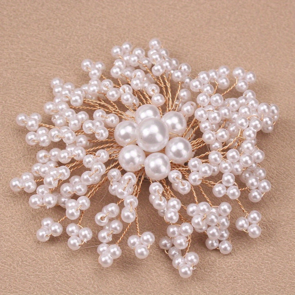 Stylish and luxurious rhinestone and pearl brooch with a unique irregular shape. This upscale fashion statement pin is perfect for coats, weddings, parties, and makes a beautiful gift.