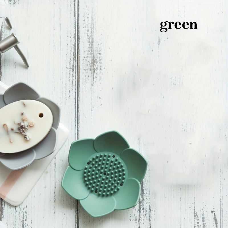 Silicone soap dish designed in the shape of a lotus flower, equipped with a drain for quick drying. Convenient and space-saving bathroom accessory.