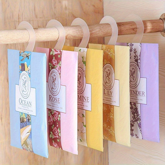 5-Pack scented sachets in assorted colors for hanging in wardrobe. Made with youth fabric for odor removal and freshening air. Great for home decor, apartment essentials, and back-to-school.