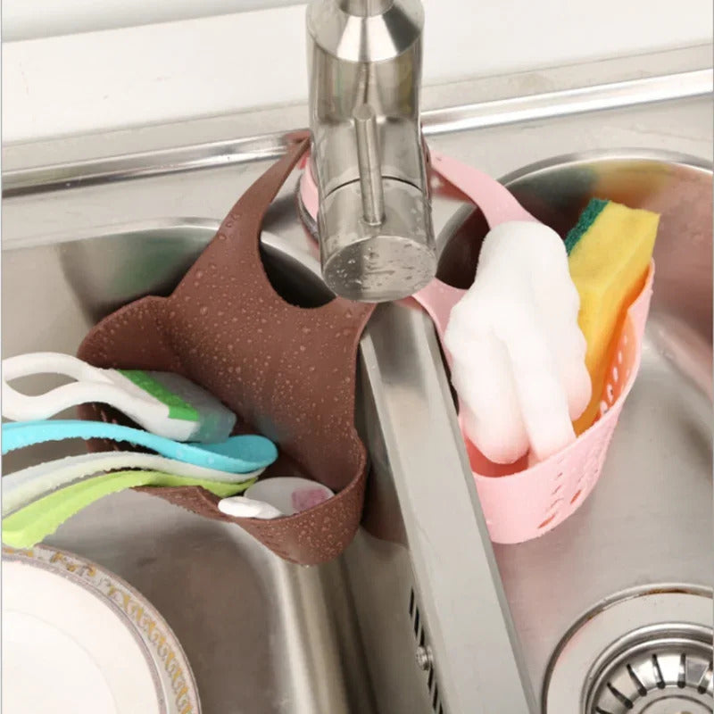 Space-saving design kitchen sink caddy made of adjustable plastic, perfect for soap and sponge storage. Hang it on your sink for easy access and keep your kitchen organized.