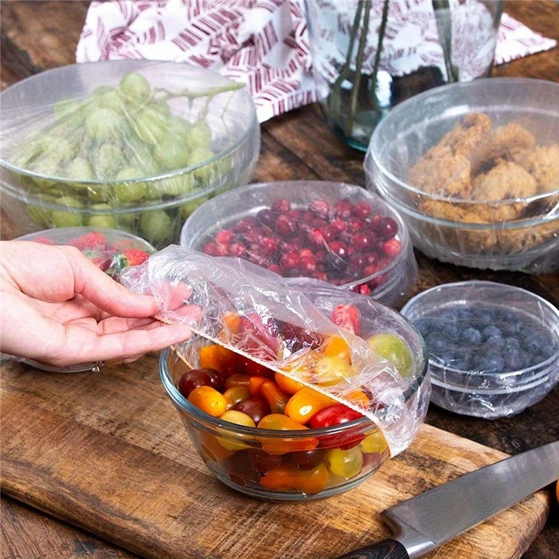 Disposable food wrap bands are sold in a pack of 100, each with elastic bands for a secure fit. These stretchable plastic covers are ideal for bowls, cups, and fruits, and are safe for food contact in the kitchen.