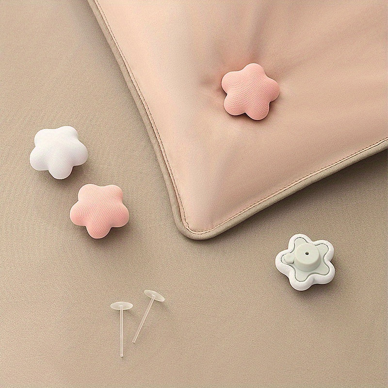 One piece of adorable star and plum blossom shaped comforter clips designed to securely hold duvets in place, prevent slipping, and keep quilts firmly in the corners. These blanket grippers come in pink and should be spot-cleaned only.