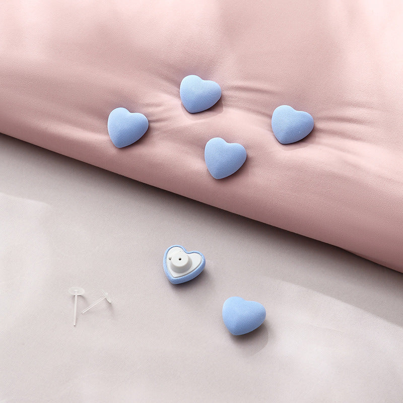 One piece of adorable star and plum blossom shaped comforter clips designed to securely hold duvets in place, prevent slipping, and keep quilts firmly in the corners. These blanket grippers come in pink and should be spot-cleaned only.