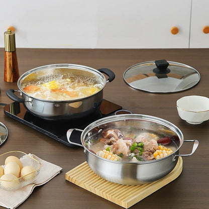 Large capacity stainless steel hot pot with lid, perfect for home and commercial use. This induction-compatible cookware set is ideal for making clear soup. The magnetic base allows for use on induction stovetops without the need for a power supply.