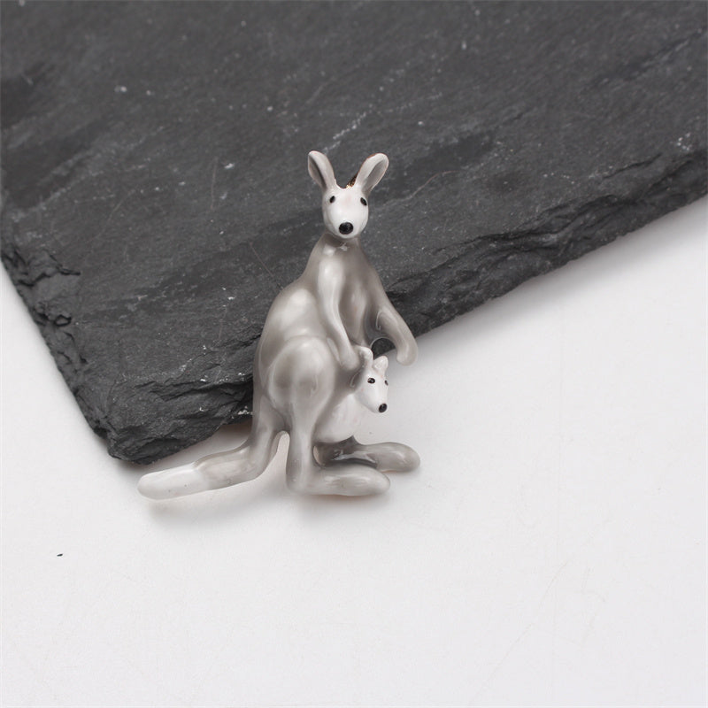 This elegant enamel kangaroo brooch is a cute and unique piece of novelty jewelry in the shape of a cartoon animal. Perfect for both men and women, it features an irregular simulation modeling design that is sure to stand out on any suit coat as a