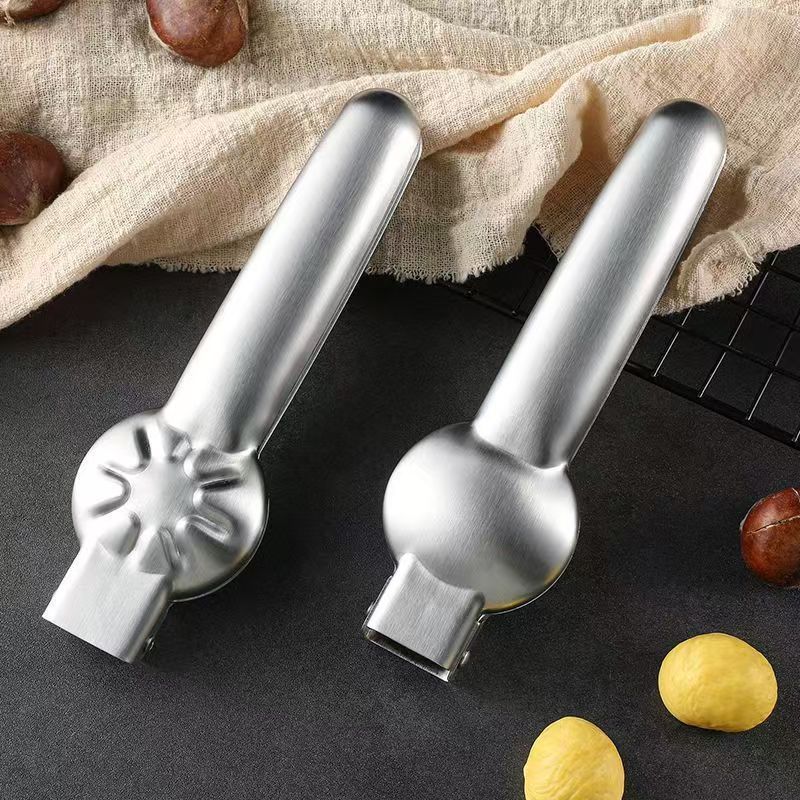 Effortlessly crack hard shells and remove pits with the Easy-Grip Stainless Steel Chestnut Opener, ideal for kitchen and dining use.