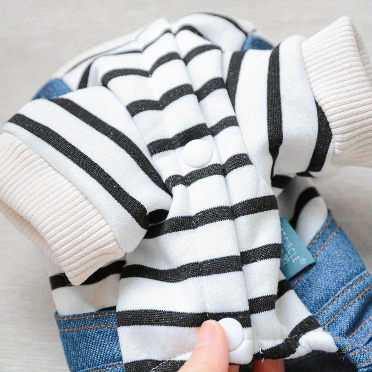 Striped denim jumpsuit for small breeds like Pomeranians and Yorkies, with easy snap closure. Ideal for all seasons.