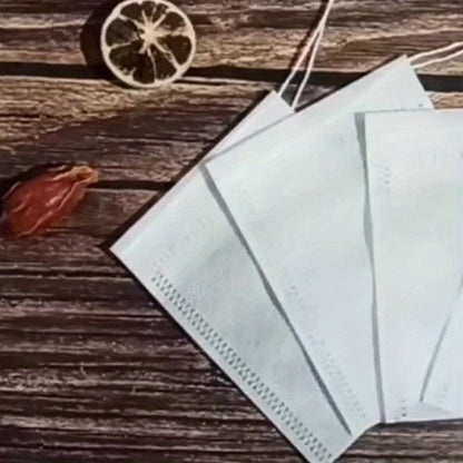 Pack of 100 transparent non-woven tea bags with drawstring, perfect for loose leaf tea and herbs. Convenient disposable pouches for storing and steeping your favorite blends.