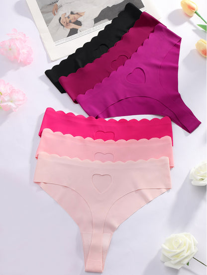 Set of 6 low-rise thong panties for women with heart design, seamless, sexy, and wave pattern edge with hollow heart details.