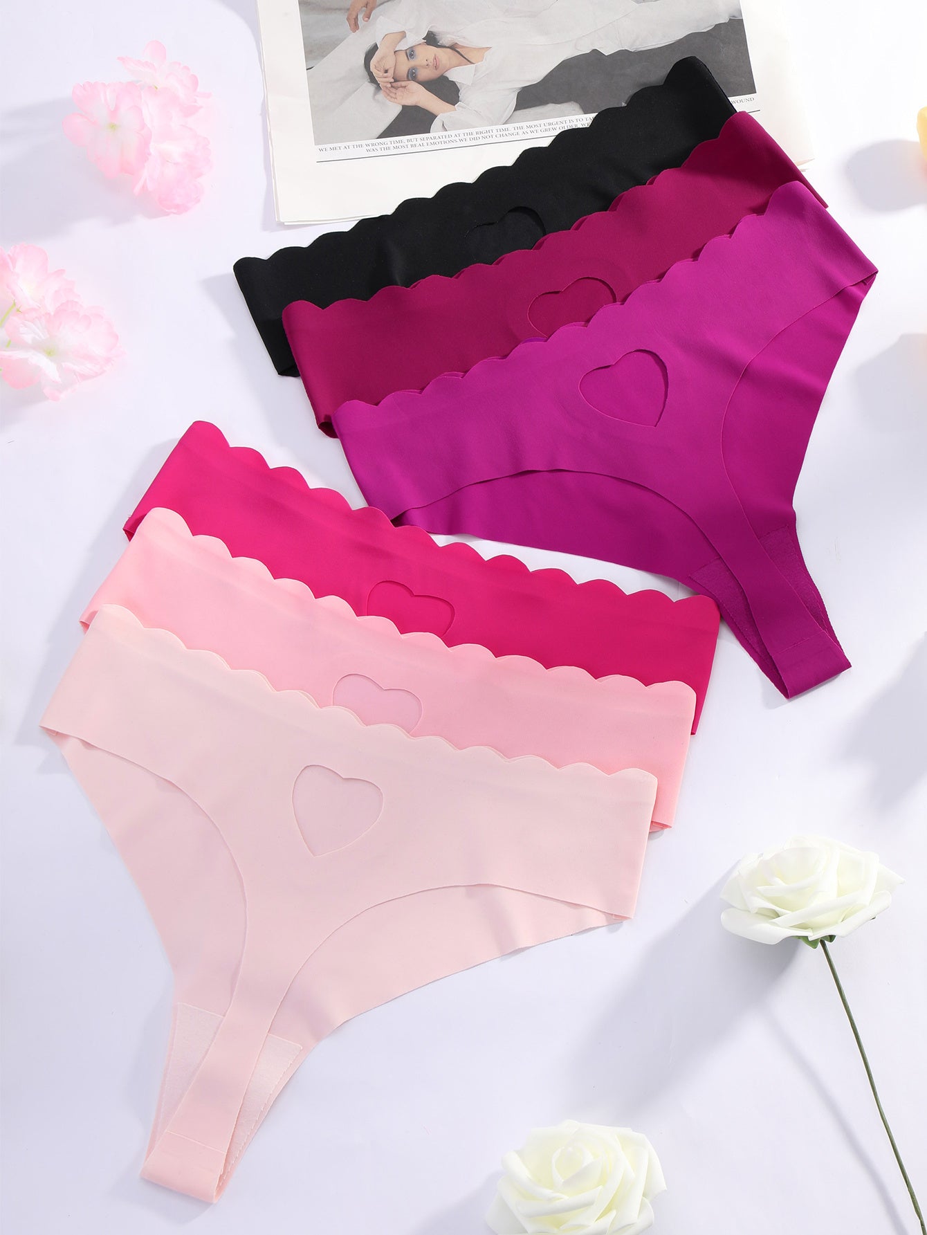 Set of 6 low-rise thong panties for women with heart design, seamless, sexy, and wave pattern edge with hollow heart details.