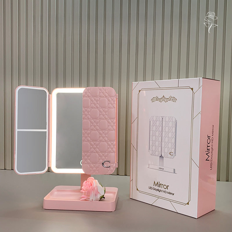 Portable LED makeup mirror with rechargeable 2000mAh battery and foldable shell design for girls. Multifunctional beauty mirror with adjustable light for dressing table.