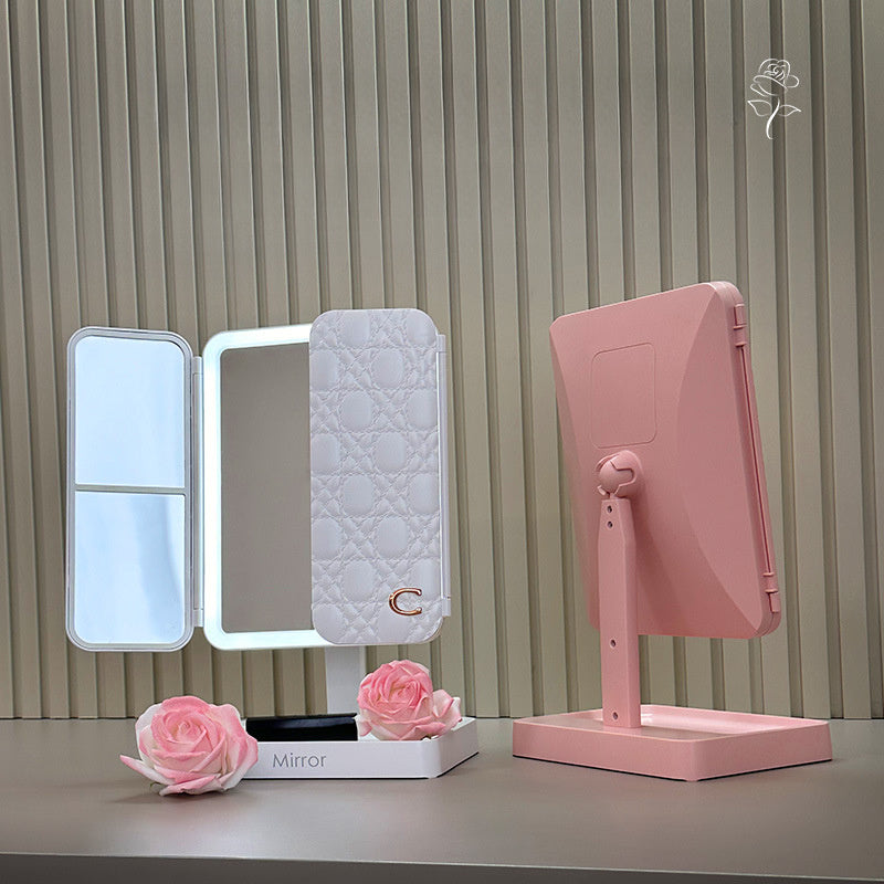 Portable LED makeup mirror with rechargeable 2000mAh battery and foldable shell design for girls. Multifunctional beauty mirror with adjustable light for dressing table.