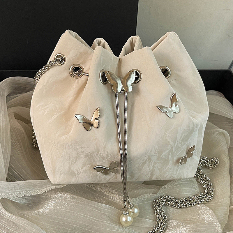 Fashionable women's bucket bag with drawstring closure, available in various colors.