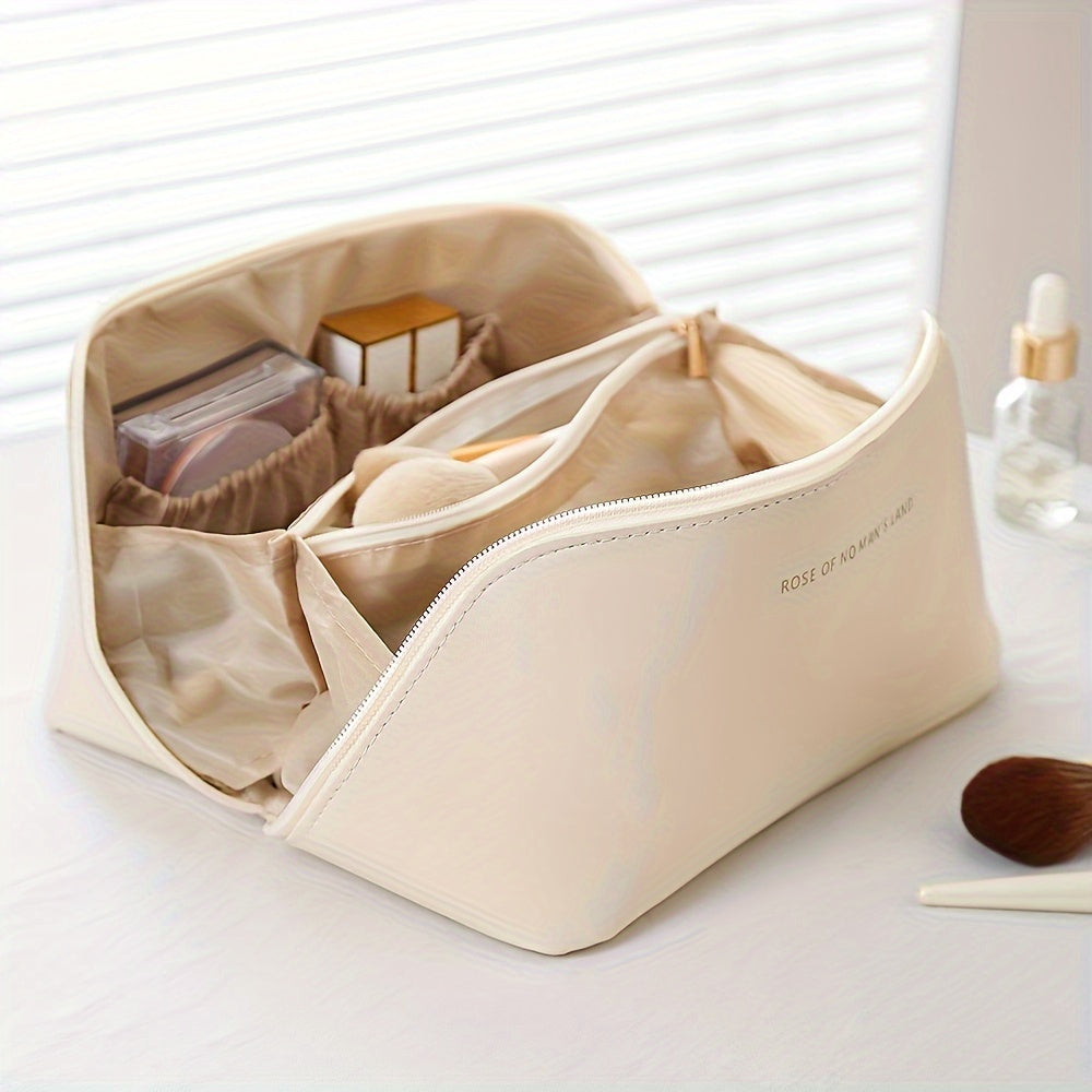 Travel makeup bag with dividers and handle, made of PU material in beige. Multi-compartment storage for skincare and makeup essentials for women.