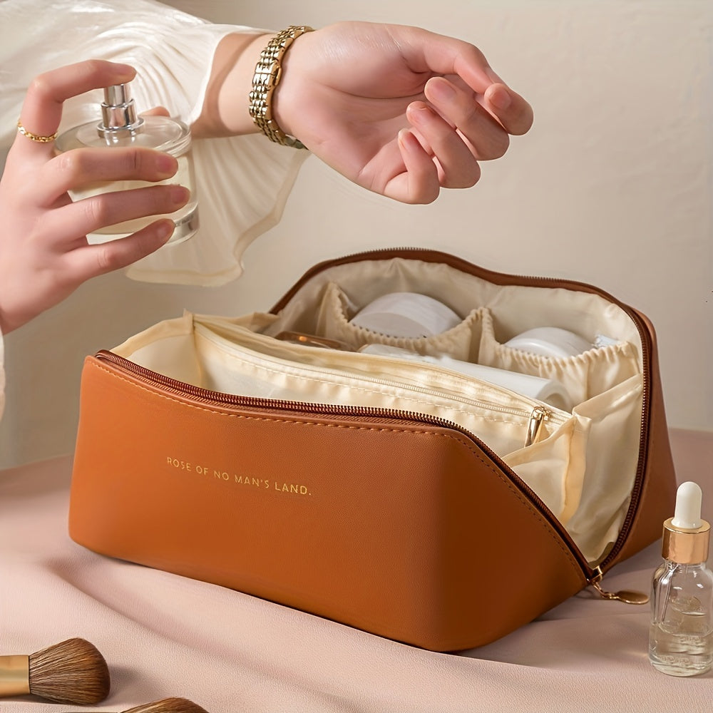 Travel makeup bag with dividers and handle, made of PU material in beige. Multi-compartment storage for skincare and makeup essentials for women.