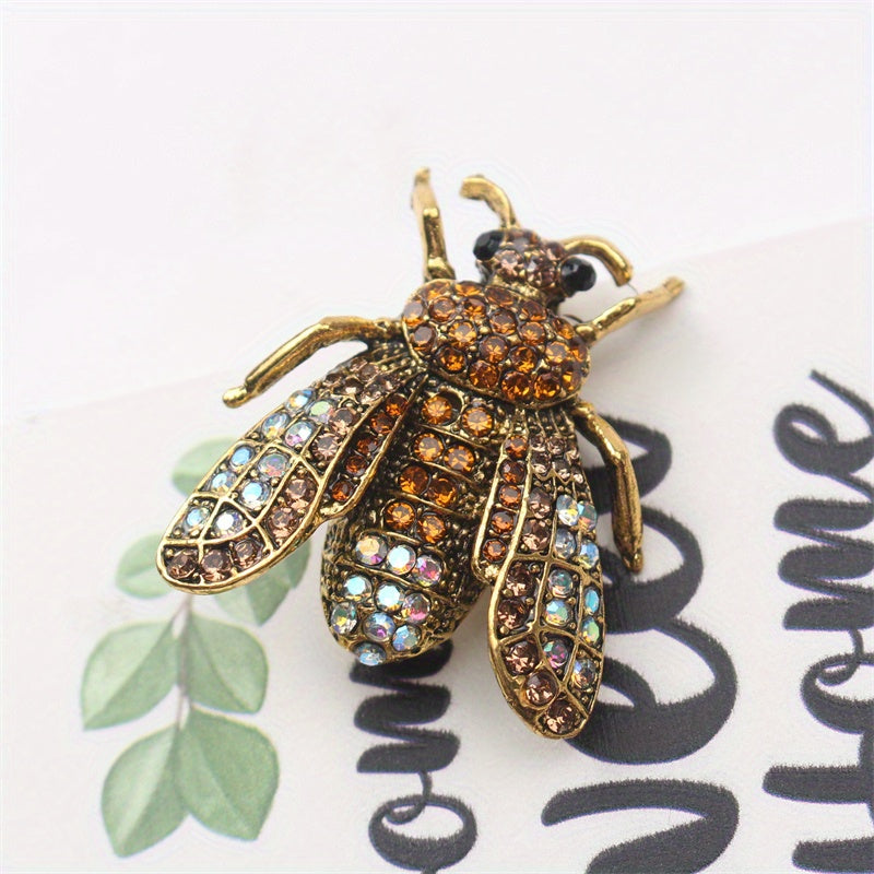 Add a touch of luxury and uniqueness to your accessories with this Vintage Rhinestone Bee Brooch, featuring an irregular shape