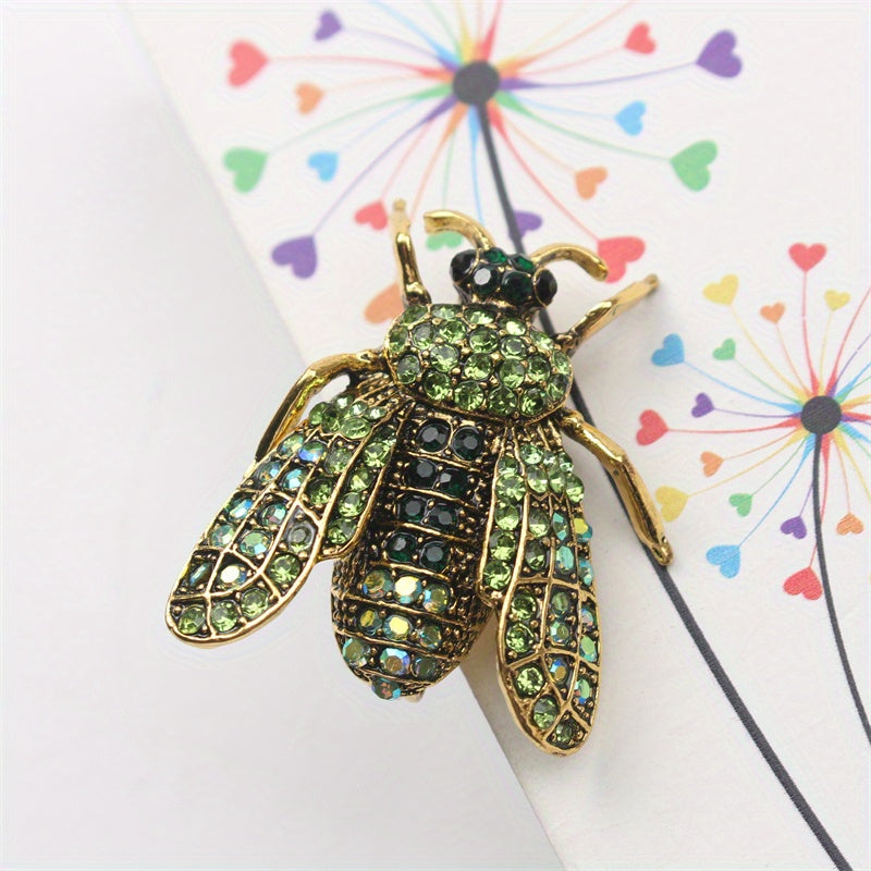 Add a touch of luxury and uniqueness to your accessories with this Vintage Rhinestone Bee Brooch, featuring an irregular shape