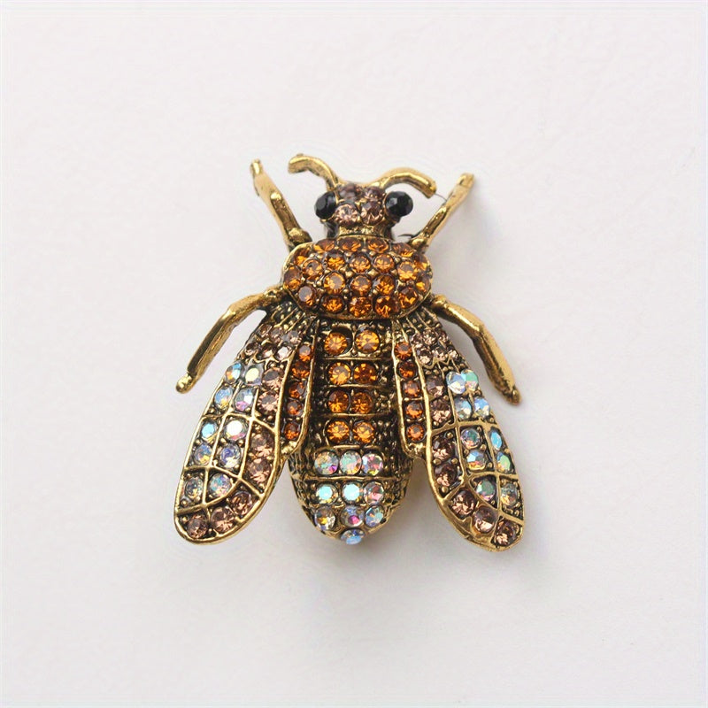 Add a touch of luxury and uniqueness to your accessories with this Vintage Rhinestone Bee Brooch, featuring an irregular shape