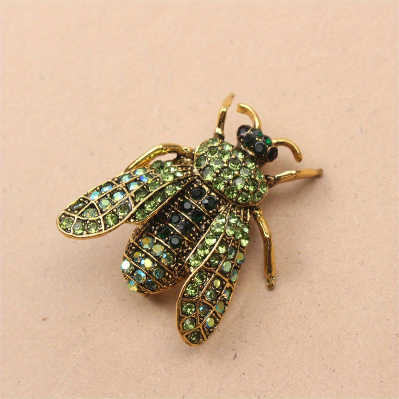 Add a touch of luxury and uniqueness to your accessories with this Vintage Rhinestone Bee Brooch, featuring an irregular shape