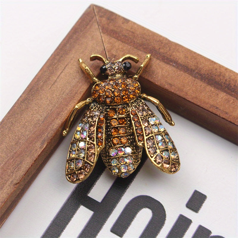 Add a touch of luxury and uniqueness to your accessories with this Vintage Rhinestone Bee Brooch, featuring an irregular shape