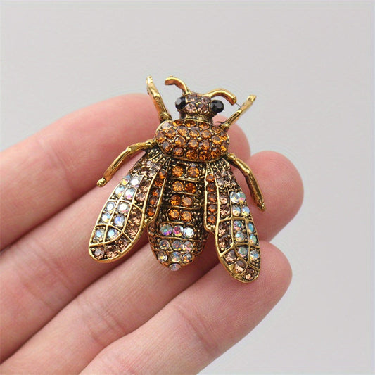 Add a touch of luxury and uniqueness to your accessories with this Vintage Rhinestone Bee Brooch, featuring an irregular shape