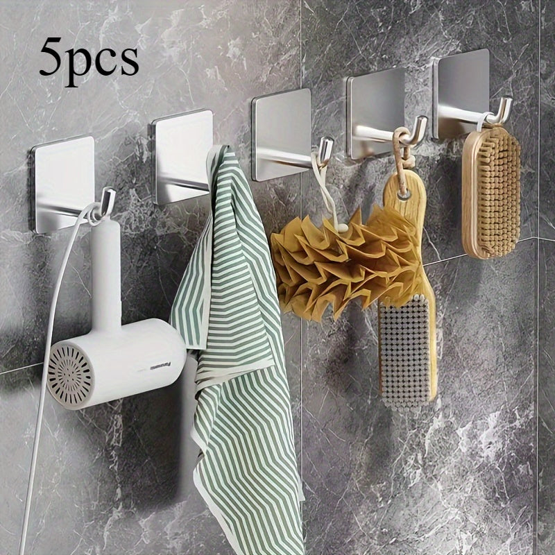 Set of 5 stainless steel sticky hooks for kitchen and bathroom decor, multi-purpose wall-mounted hangers. Ideal for heavy-duty use.