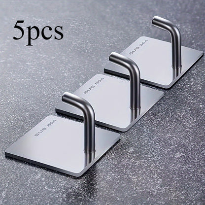 Set of 5 stainless steel sticky hooks for kitchen and bathroom decor, multi-purpose wall-mounted hangers. Ideal for heavy-duty use.