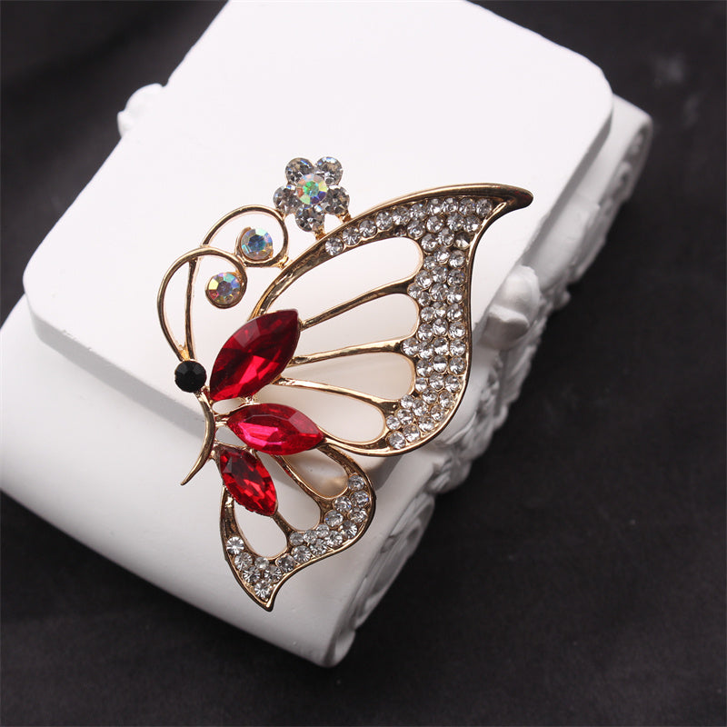 Retro-style brooch corsage coat pin featuring a butterfly and flower design.