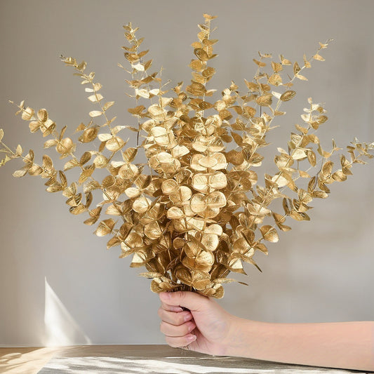 10-piece set of artificial golden eucalyptus stems for home and wedding decor, ideal for vase fillers and tabletop accents.