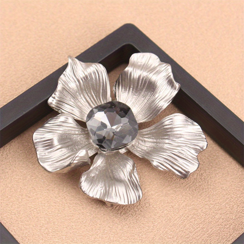 Add a touch of elegance with this luxurious rhinestone flower brooch pin. A versatile accessory that can be used on clothing, bags, and hats to enhance your personal charm for any occasion - whether you're traveling, attending a party, or simply going