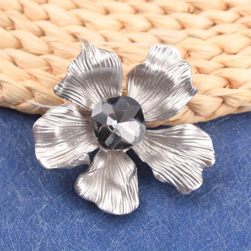 Add a touch of elegance with this luxurious rhinestone flower brooch pin. A versatile accessory that can be used on clothing, bags, and hats to enhance your personal charm for any occasion - whether you're traveling, attending a party, or simply going