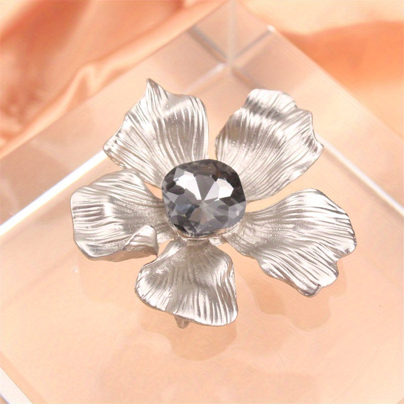 Add a touch of elegance with this luxurious rhinestone flower brooch pin. A versatile accessory that can be used on clothing, bags, and hats to enhance your personal charm for any occasion - whether you're traveling, attending a party, or simply going