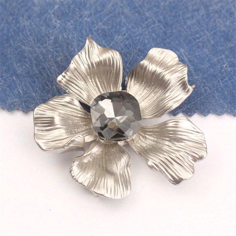 Add a touch of elegance with this luxurious rhinestone flower brooch pin. A versatile accessory that can be used on clothing, bags, and hats to enhance your personal charm for any occasion - whether you're traveling, attending a party, or simply going