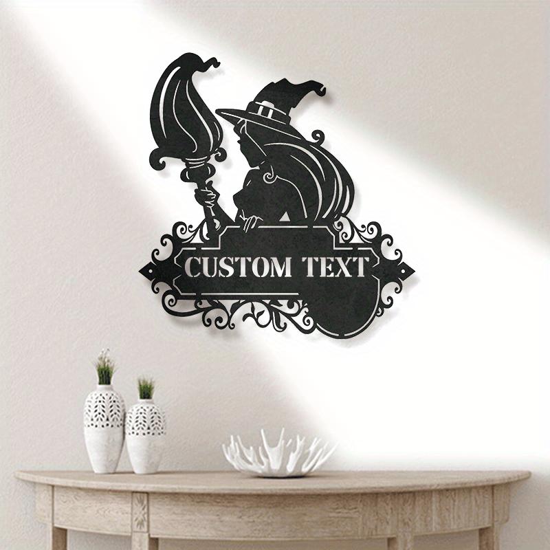 Decorate your home with a custom metal door hanger featuring a black witch and cat silhouette. Personalize it with your family name for a unique touch. This durable iron hanging art is perfect for Halloween and outdoor patio decor. Suitable for the