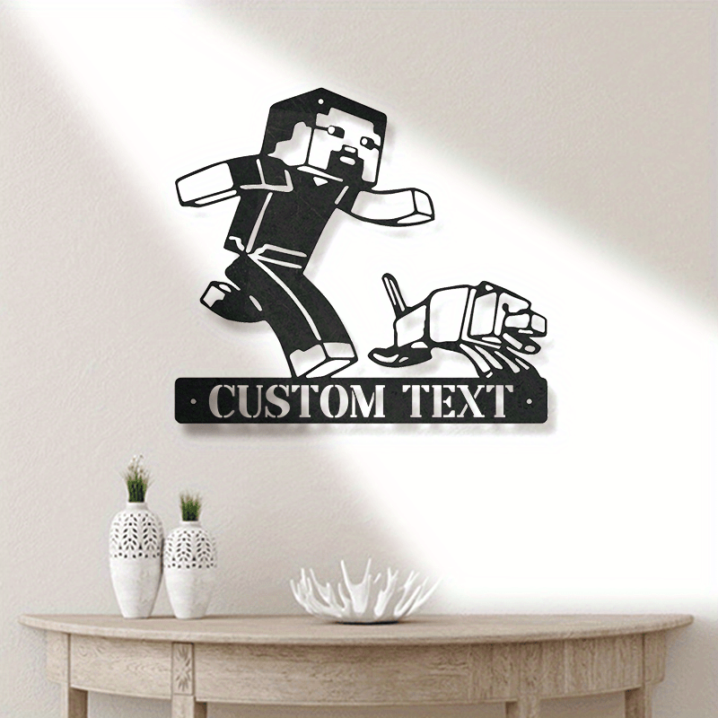 Personalize your space with our customizable black metal wall art featuring a gaming character cutout plaque. Perfect for adding a unique touch to your home, office, garden, or patio decor, this durable metal piece also makes a great housewarming gift.