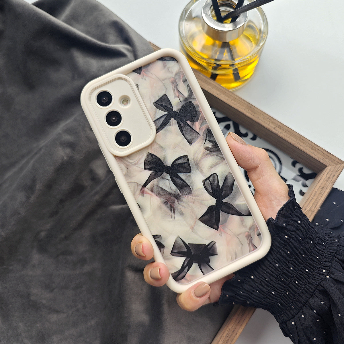 Translucent bow black full screen soft shell phone case for Samsung and iPhone models.