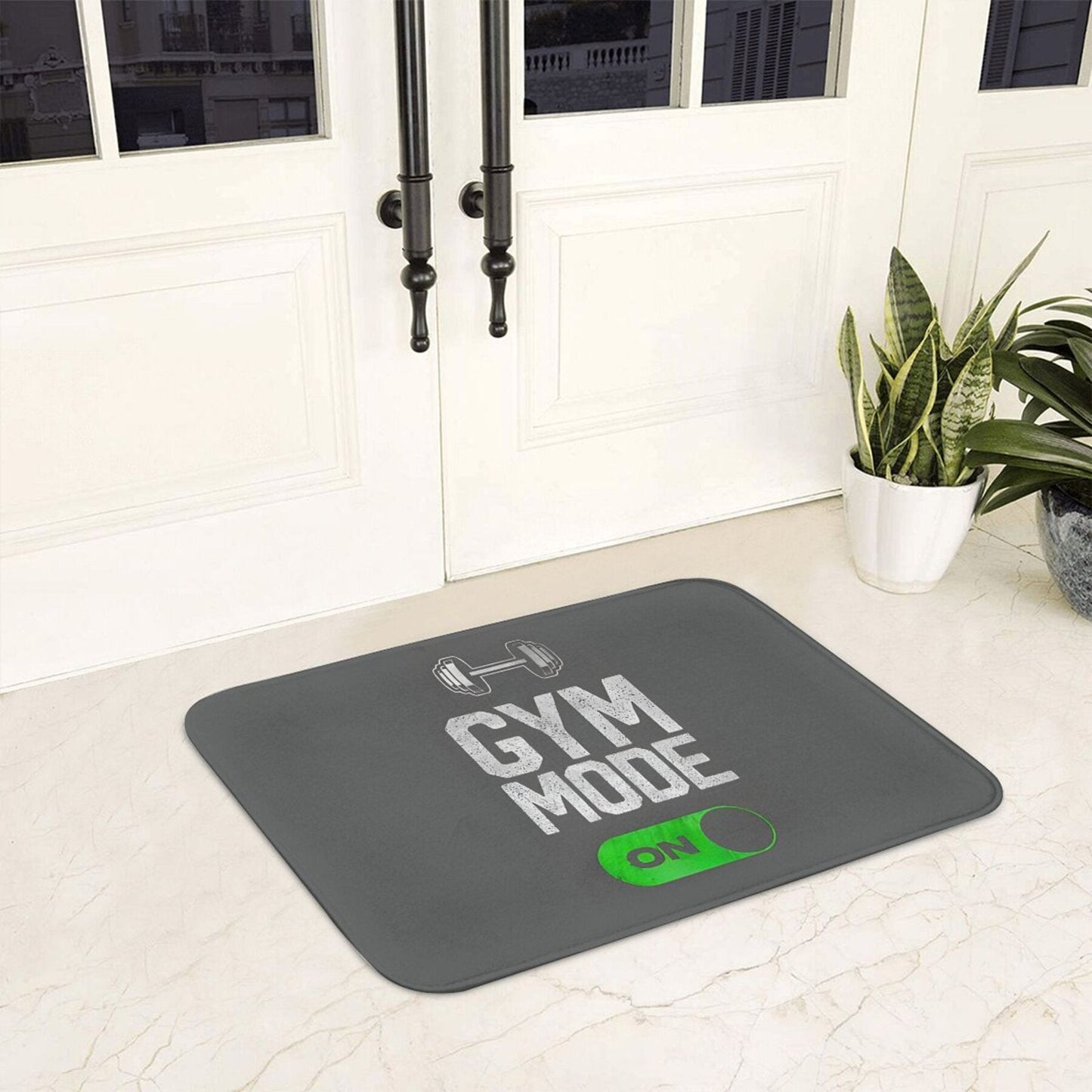 Polyester doormat with non-slip backing that is machine washable. Features a "Gym Mode Activated" design, suitable for bathroom, kitchen, and entrance. This lightweight rectangular floor mat is perfect for home decor.