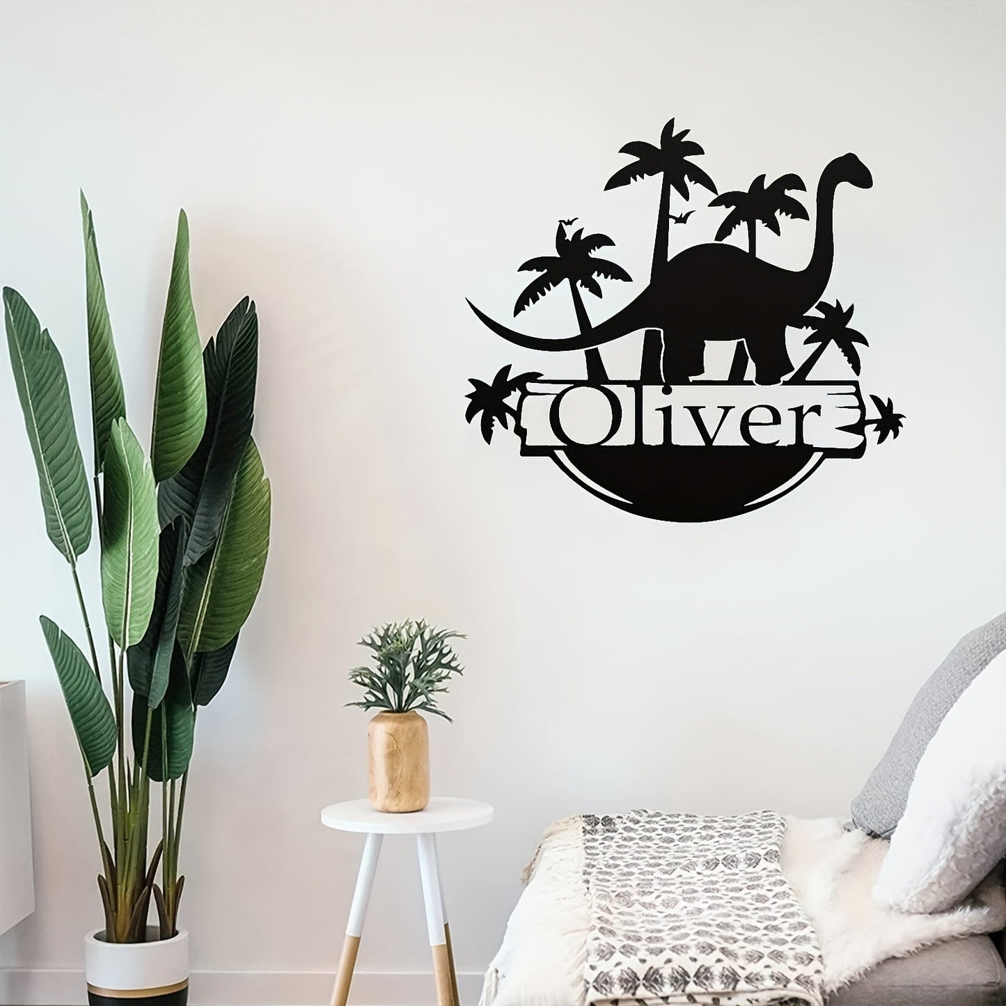 Customize your very own dinosaur metal door hanger with a personalized name. This unique home decor and nursery wall art piece is made of black metal and is perfect for ages 14 and up.