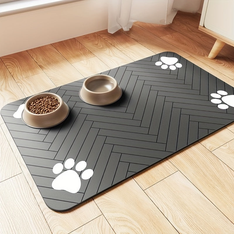 Fast-drying diatomaceous earth pet feeding mat for dogs and cats. Splash-proof, absorbent, easy to clean. Herringbone pattern with paw print design in black. Washable.