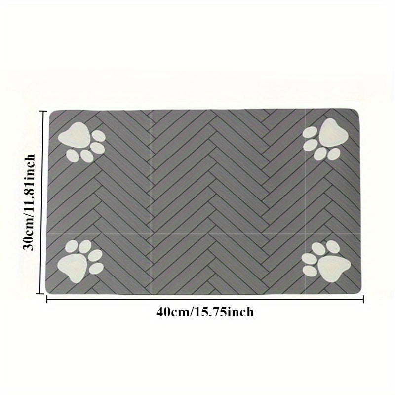 Fast-drying diatomaceous earth pet feeding mat for dogs and cats. Splash-proof, absorbent, easy to clean. Herringbone pattern with paw print design in black. Washable.