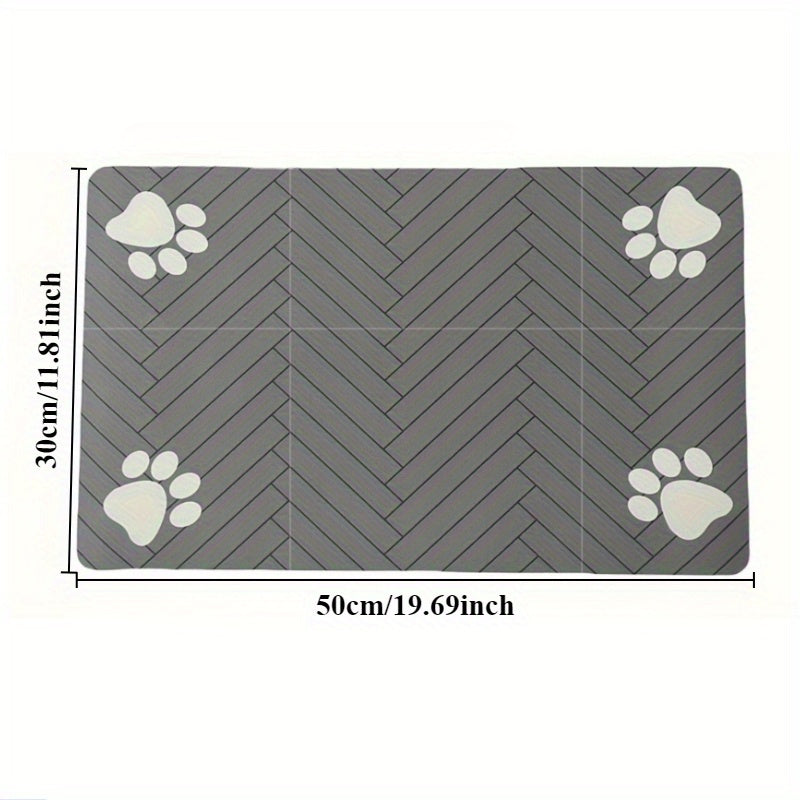 Fast-drying diatomaceous earth pet feeding mat for dogs and cats. Splash-proof, absorbent, easy to clean. Herringbone pattern with paw print design in black. Washable.