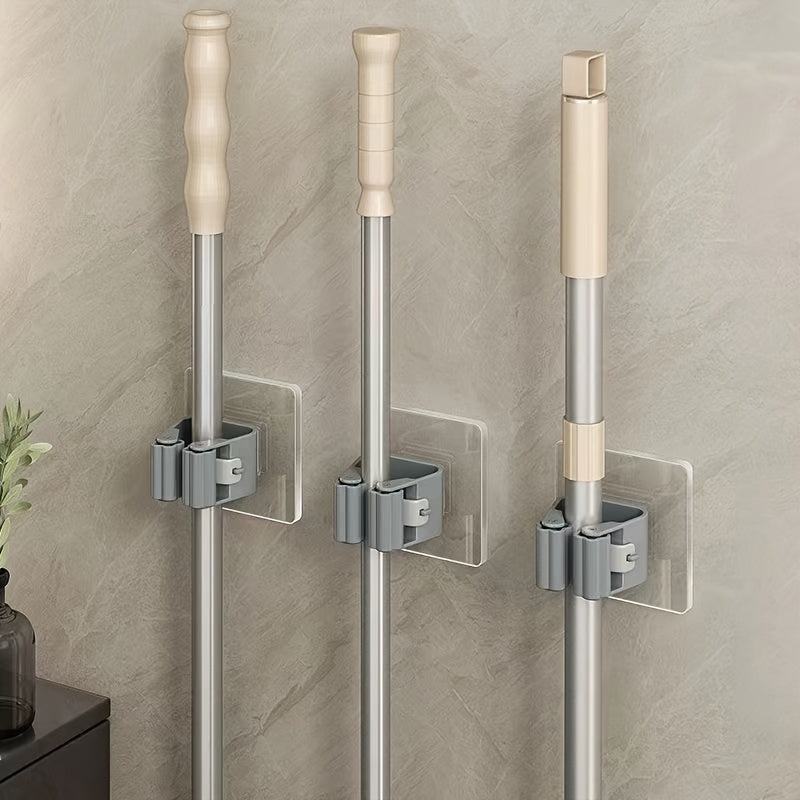 6-Pack of contemporary wall-mount mop and broom holders made of heavy-duty plastic for easy installation in the bathroom and kitchen with a modern style.