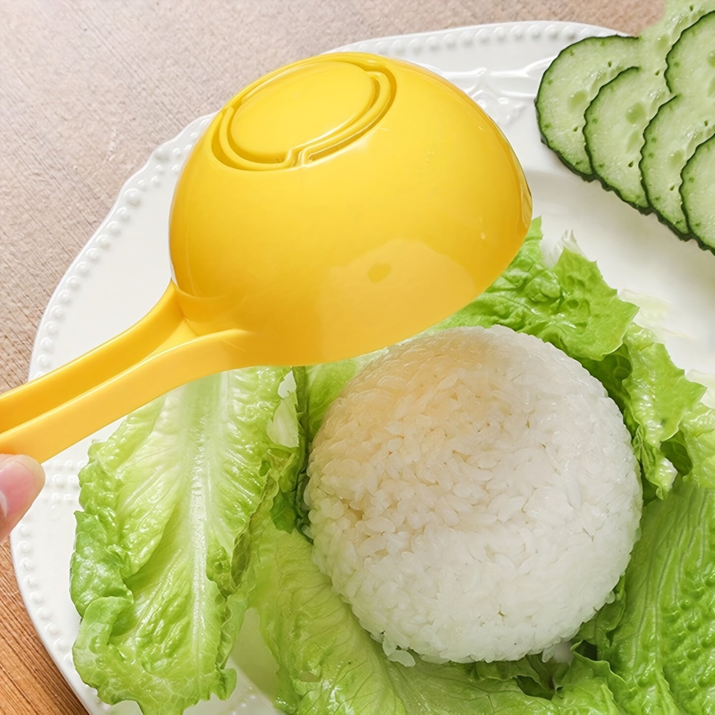 Durable plastic rice shaping tool for home use.