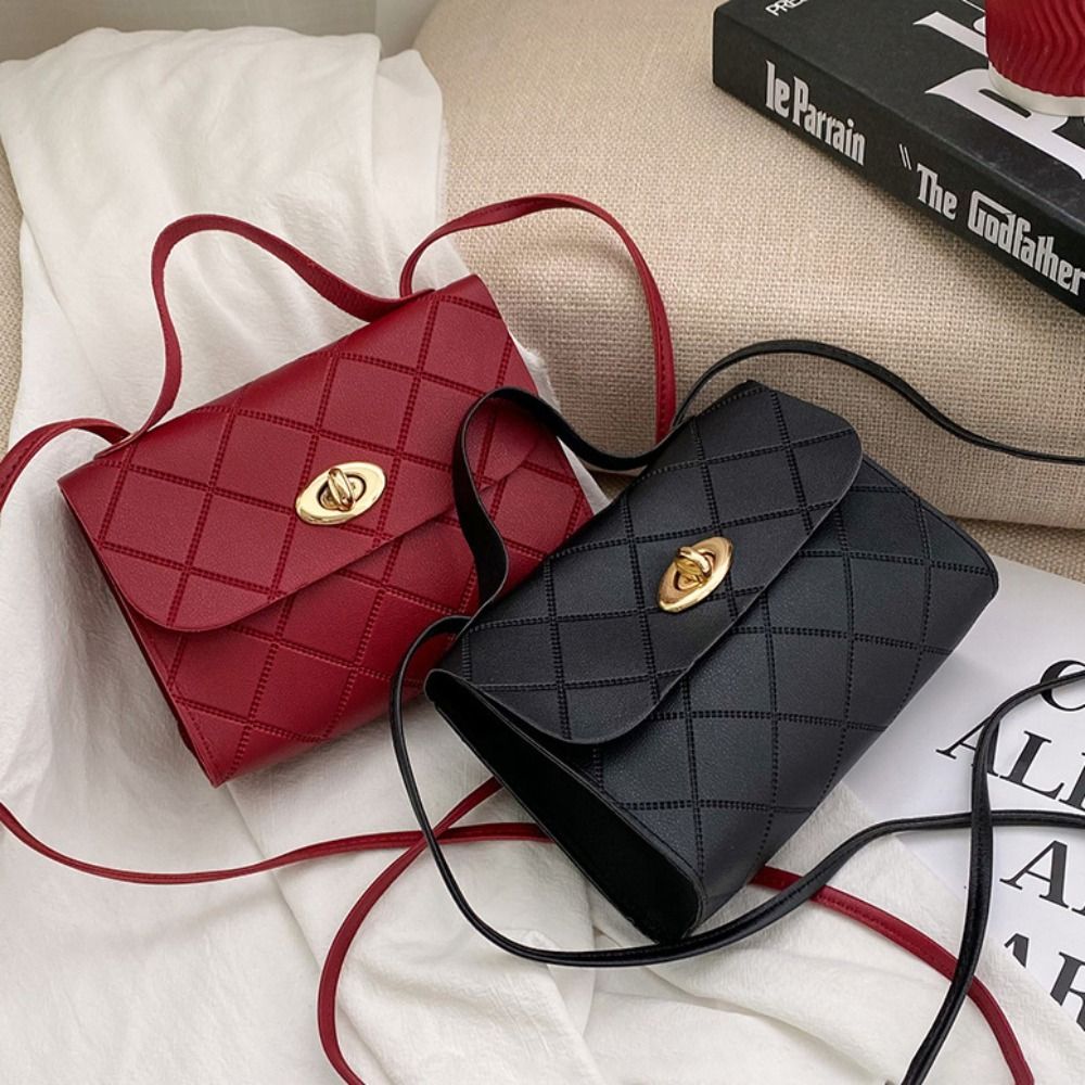 Stylish mini crossbody bag for women, with solid color, polyester lining, secure buckle closure, also available in red/black.